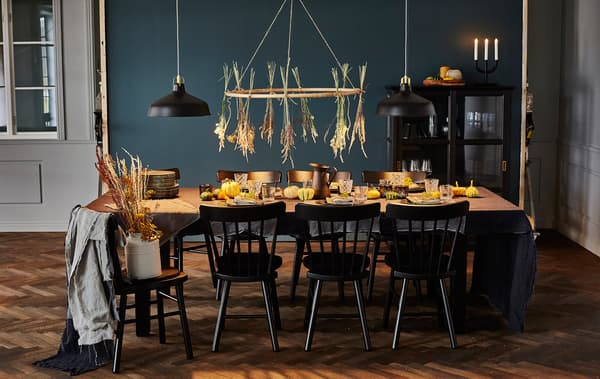 A table setting ready for a harvest-themed dinner party.