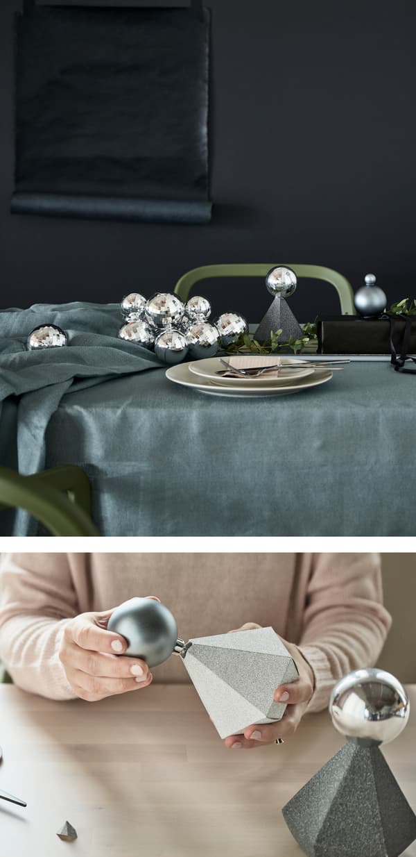 A table setting with silver decorative balls and white place setting