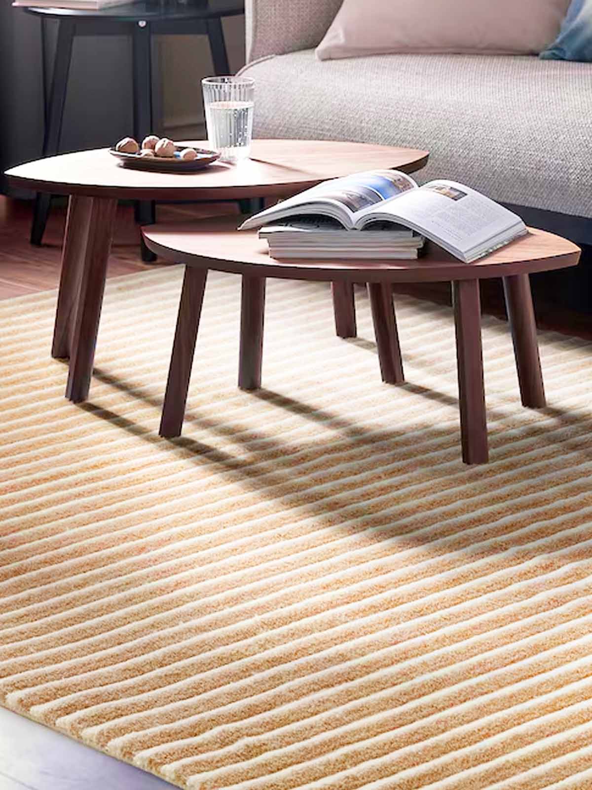 A TÅGSPÅR rug, high pile below STOCKHOLM nest of tables on top of it in the living room.