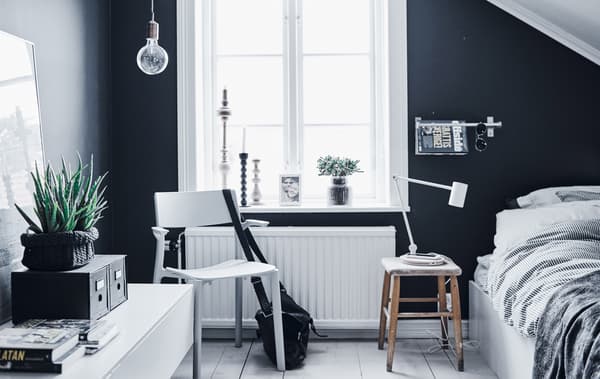 A teenager's monochrome bedroom in black and white.