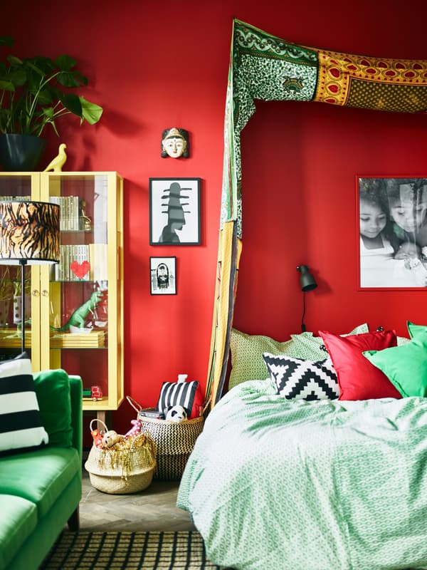 A textile canopy made up of different patterns and fabrics helps give this bedroom its distinctive Bohemian look.