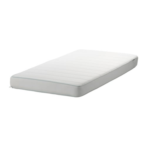 A thin crib mattress against a white background.