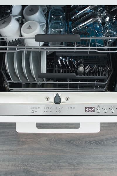 A top focused view of the door of a dishwasher, showing the buttons.