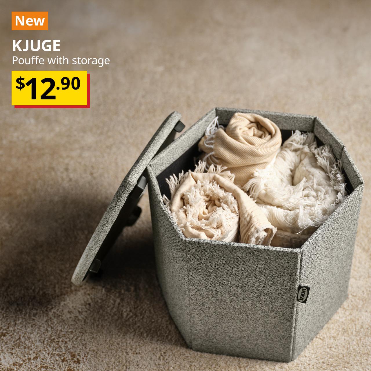 A top view of a Öreryd grey-beige KJUGE pouffe with it's seat open to reveal hidden storage. Black text overlay image on the left that reads, "KJUGE, Pouffe with storage" with the BTI price in yellow/red and black text: $12.90.