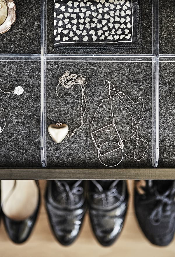 A tray with accessories and shoes.