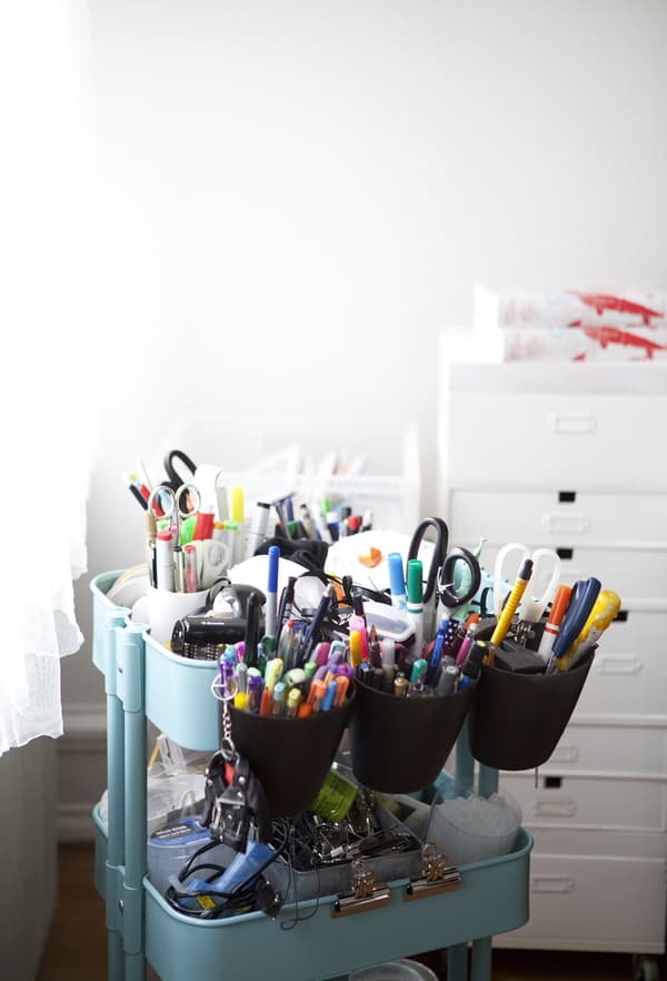 A trolley full of art supplies.