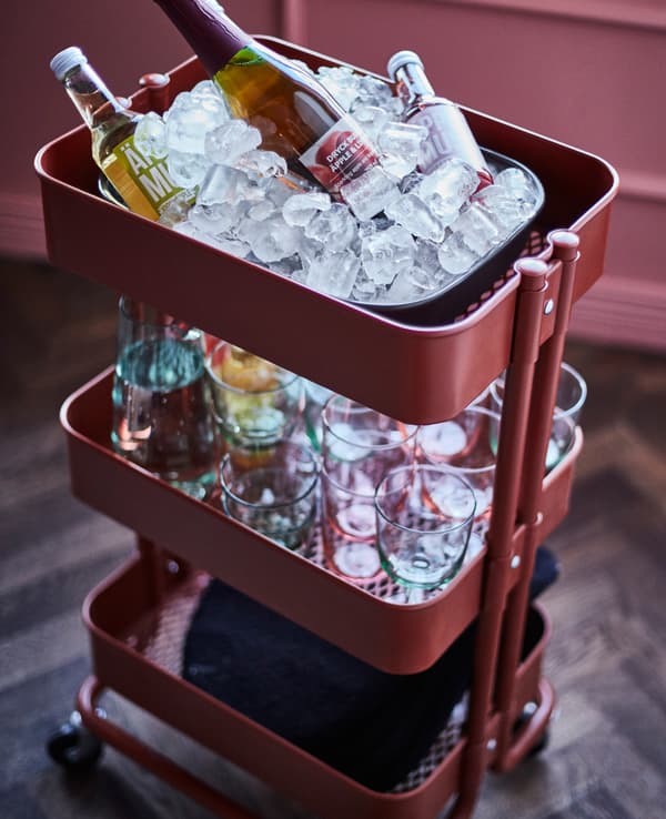 A trolley is used to hold drinks on ice, glasses, napkins and drink mixers.