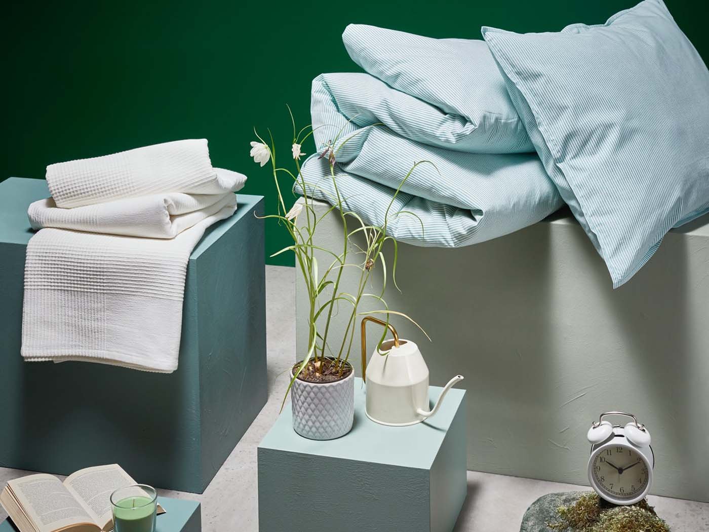 A variety of of home furnishing products including bedding, a plant pot and a clock that could be purchased as a gift.