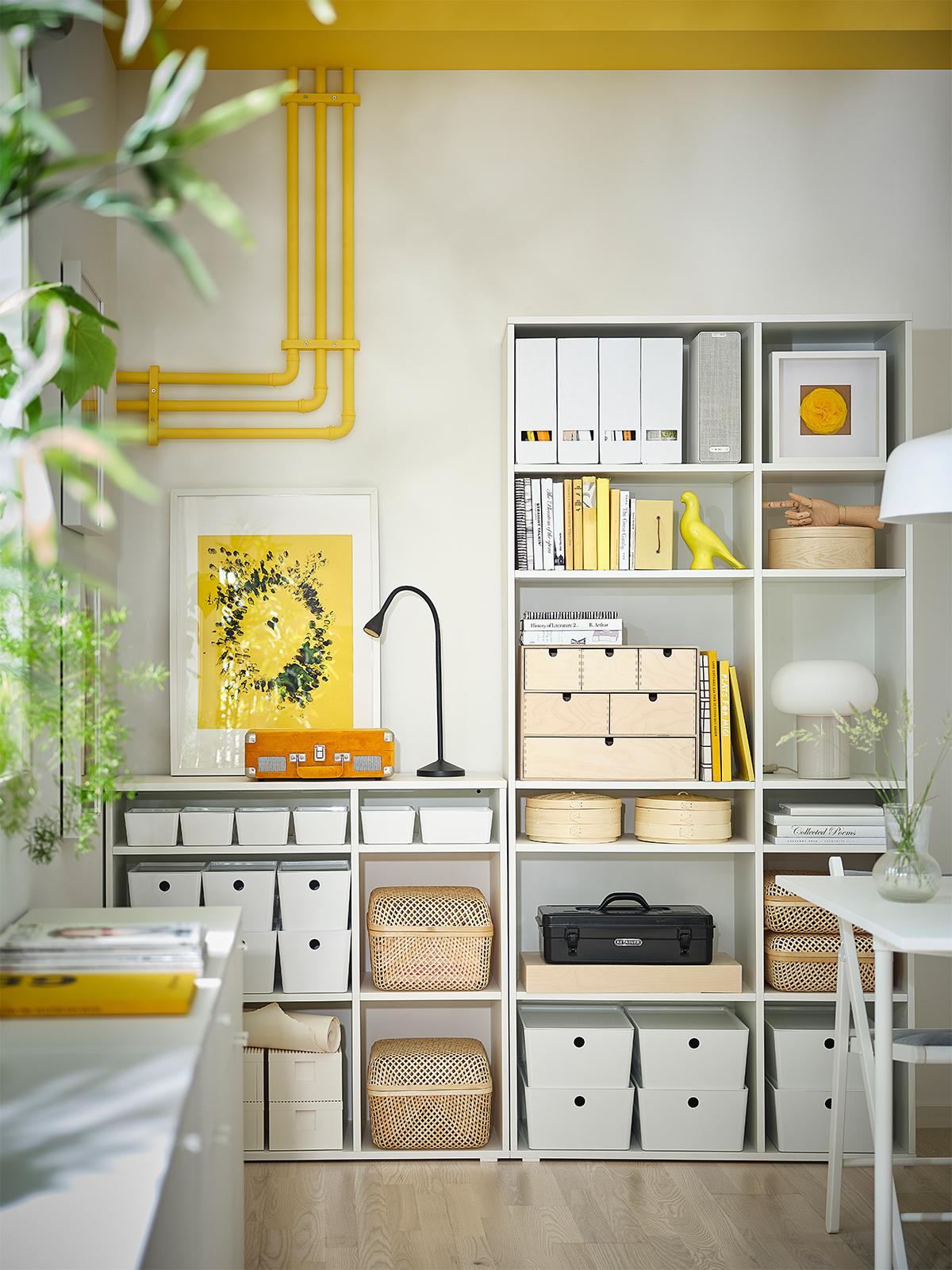 A VIHALS storage unit with office articles in the living room.