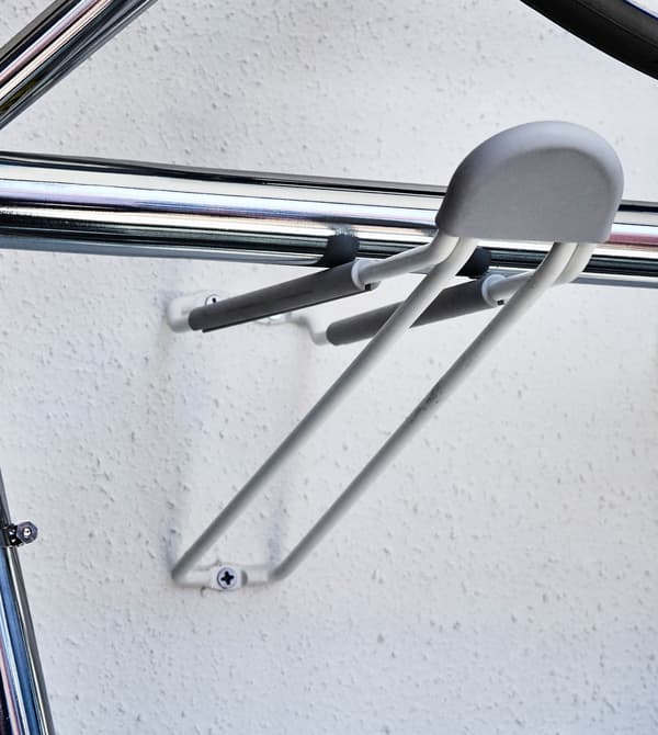 A wall rack perfectly stores a bike.