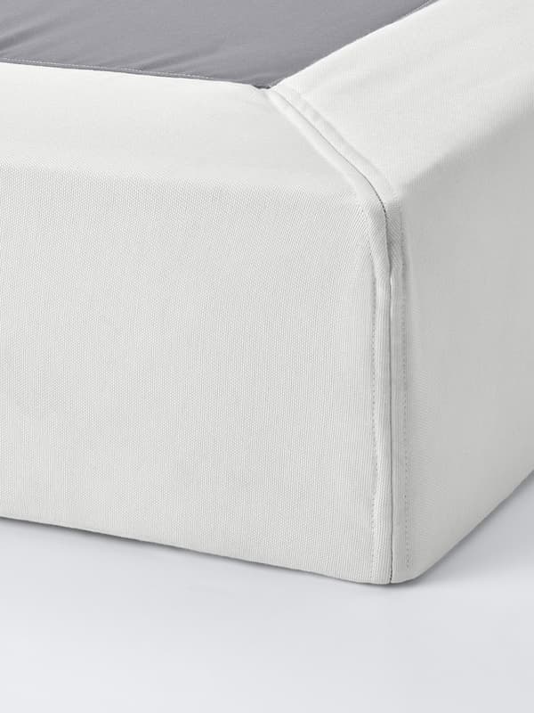 a white bed/mattress foundation