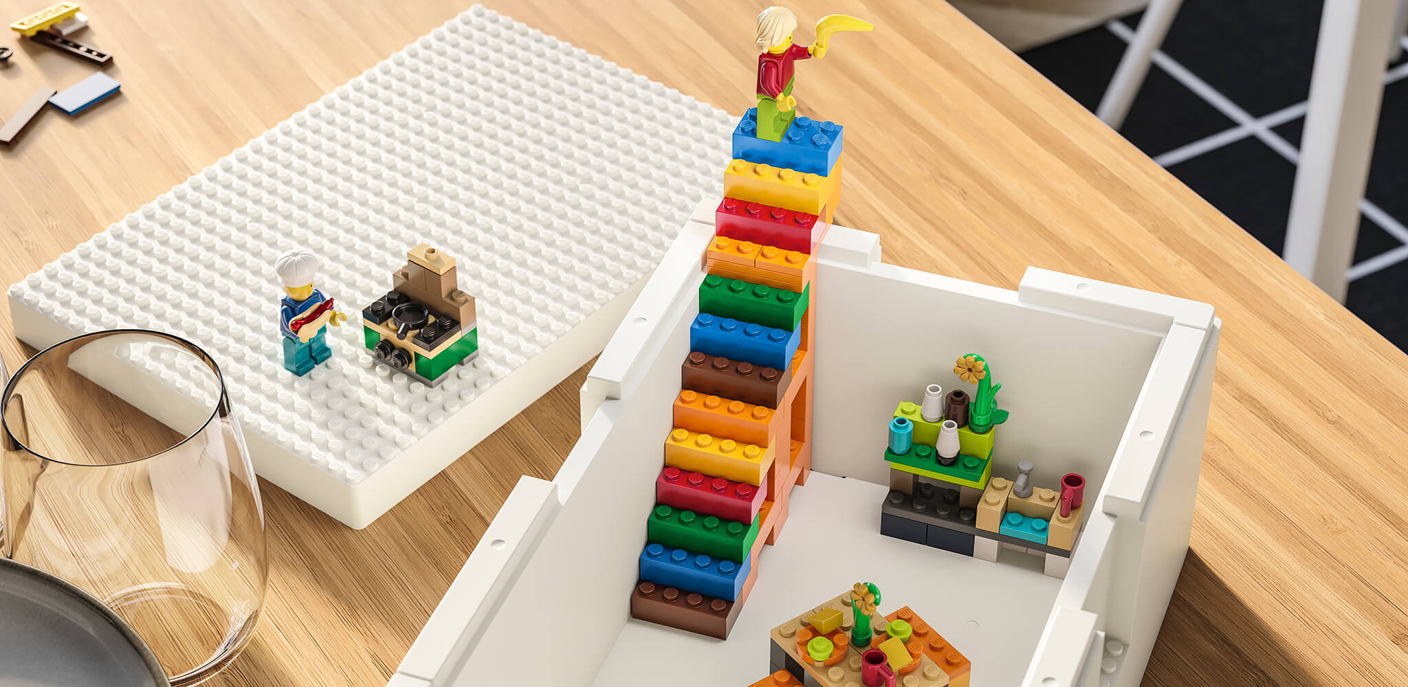 a white box with lego toys inside 