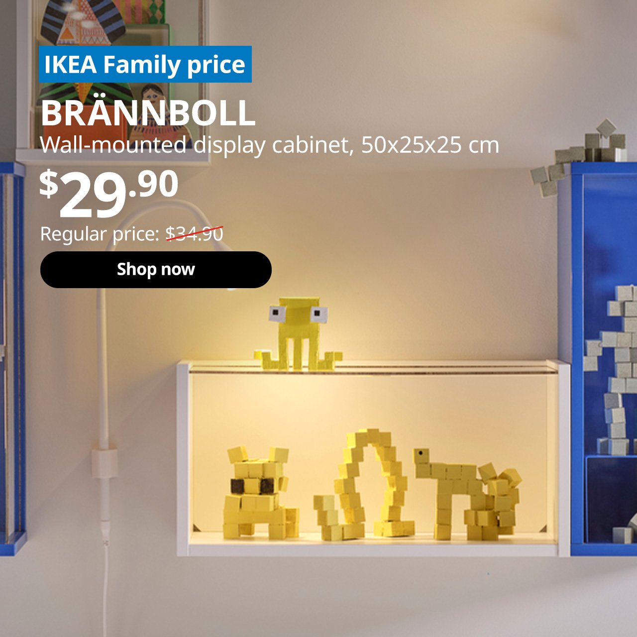 A white BRÄNNBOLL wall-mounted display cabinet. A blue tag with white text that reads "IKEA Family price", followed by black text overlaying the image that reads "BRÄNNBOLL, Wall-mounted display cabinet, 50x25x25 cm, $29.90, Regular price $34.90".