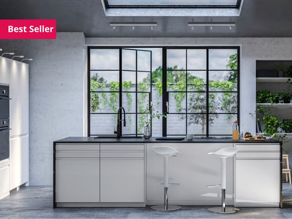 A white high-gloss IKEA VOXTORP kitchen with white worktop.
