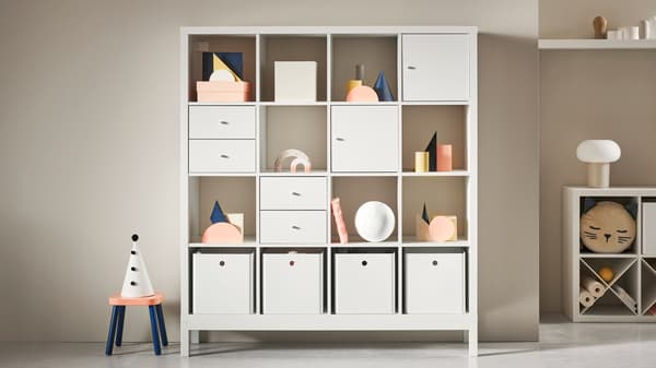 A white KALLAX cabinet from the KALLAX series.