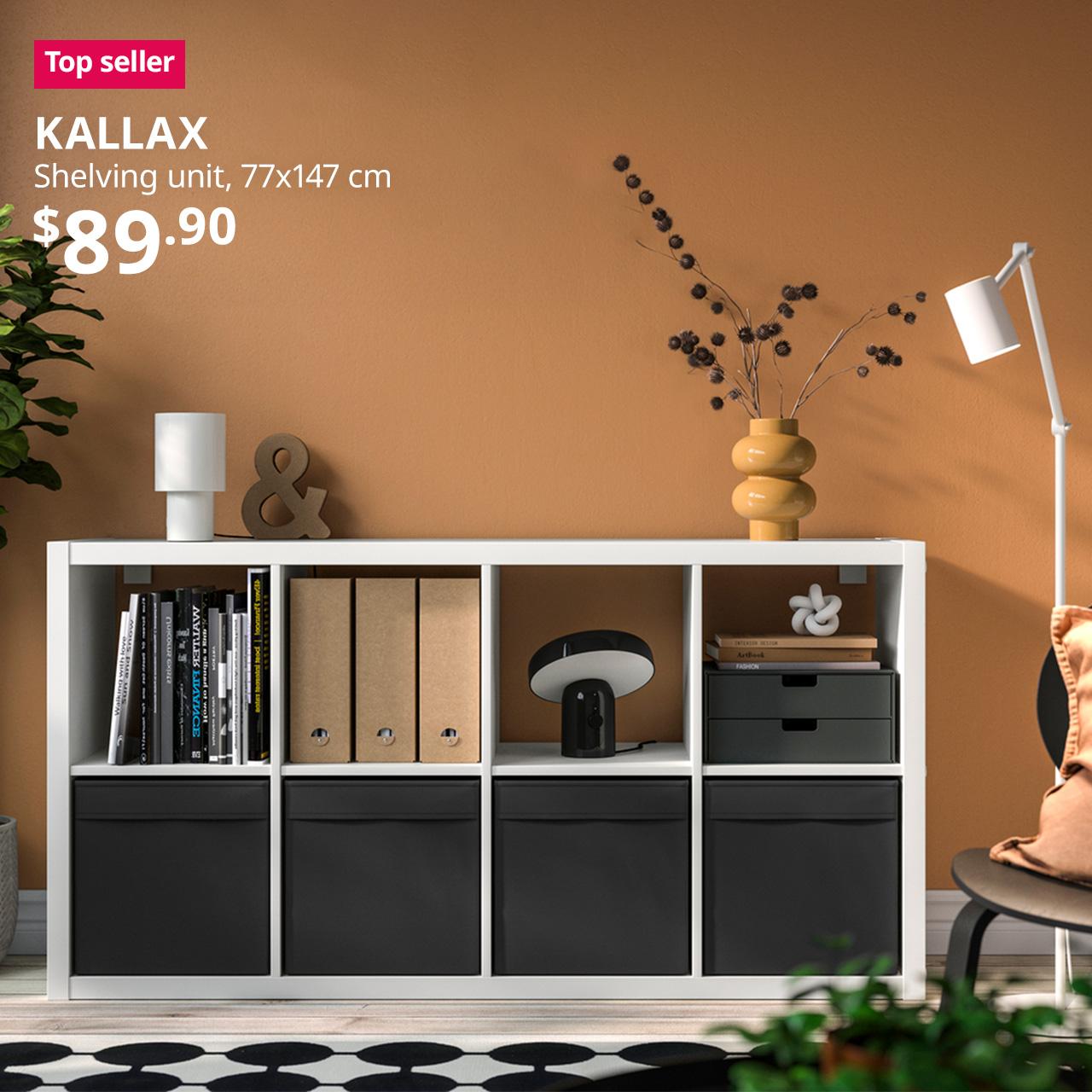 A white KALLAX shelving unit is being used as an open display shelving and storage unit in a living room setting. A reddish pink "Top seller" tag is displayed on the top left corner of the image, followed by a white text overlay image that reads, "KALLAX, Shelving unit, 77x147 cm, $89.90".