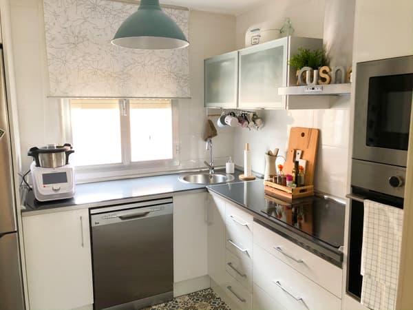 A white kitchen with pastel tones
