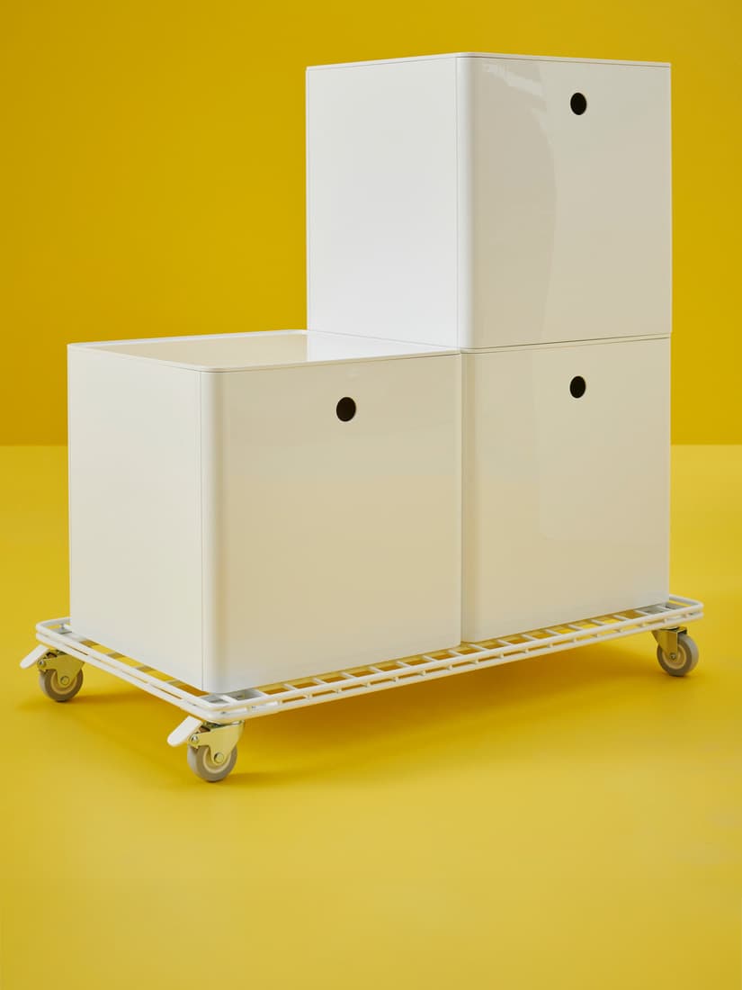 A white KUGGIS storage box with lid
