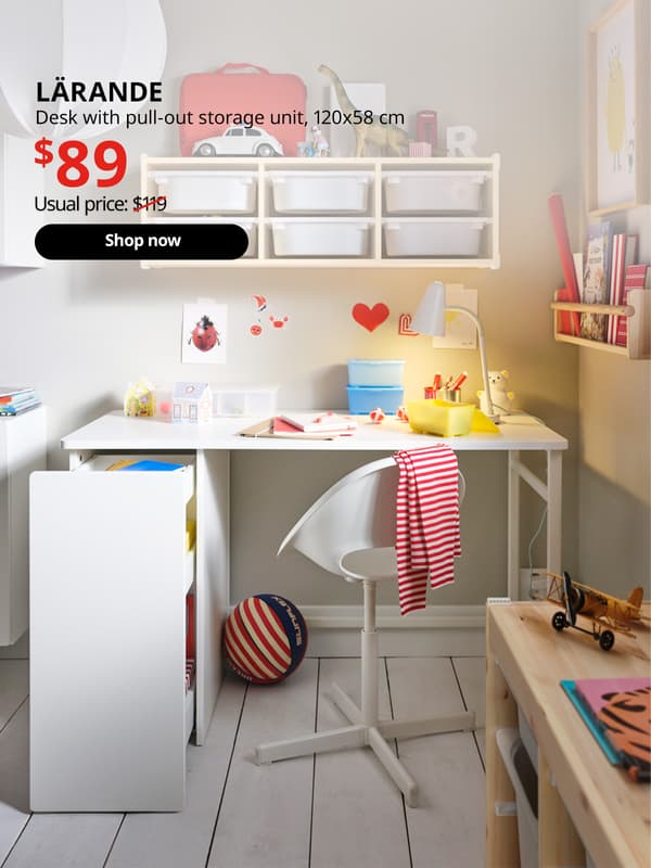 A white LÄRANDE pull-out storage unit in a children's room setting. Black text over image that reads "LÄRANDE, Desk with pull-out storage unit. Price at $89, Usual price $119"