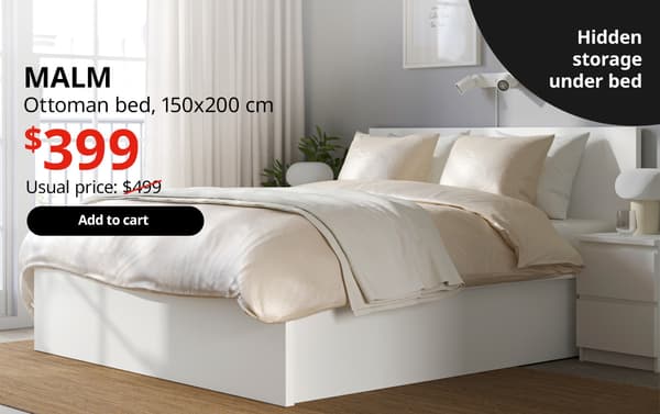 A white MALM ottoman bed in a bedroom setting. On the top left-hand corner, black text that reads 