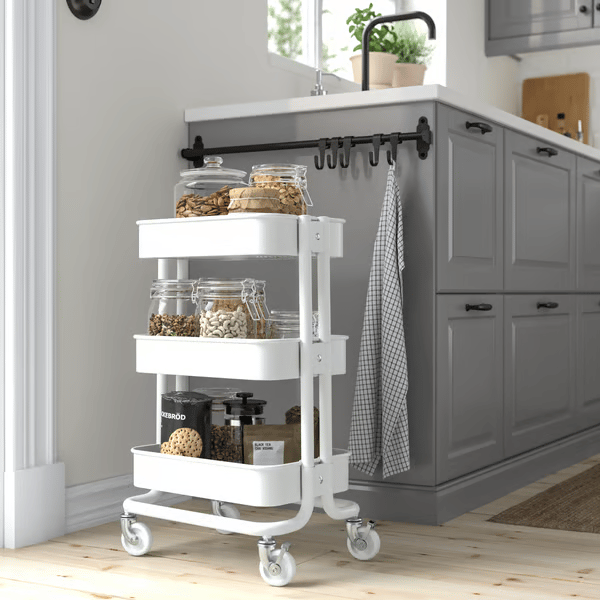 A white RÅSKOG trolley