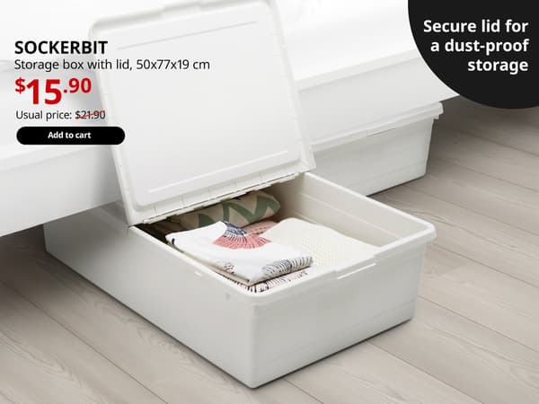 A white SOCKERBIT storage box with a lid is utilised as under-bed storage in the bedroom setting. On the top left-hand corner, black text that reads 