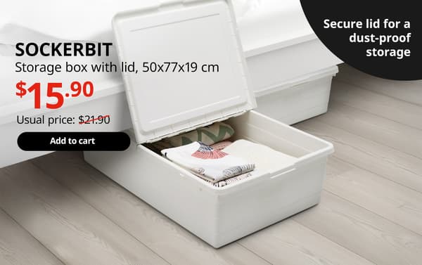 A white SOCKERBIT storage box with a lid is utilised as under-bed storage in the bedroom setting. On the top left-hand corner, black text that reads 