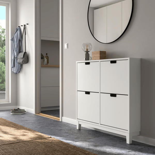 A white STÄLL shoe cabinet with 4 compartments