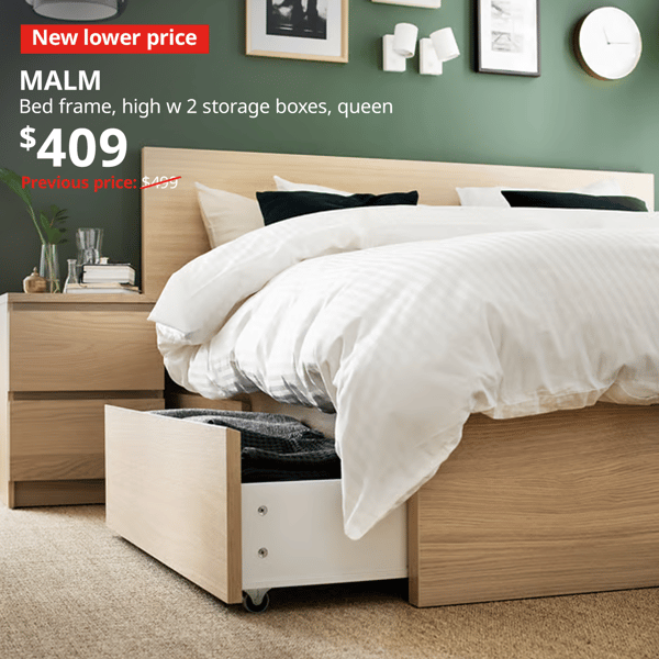 A white-stained oak queen sized MALM bedframe with 2 storage drawers in a bedroom with white sheets and duvet covers. A red "New lower price" label is on the top left of the image with white text that reads: MALM, Bedframe high w 2 storage boxes, queen, Price at $409, Previous price, $499.
