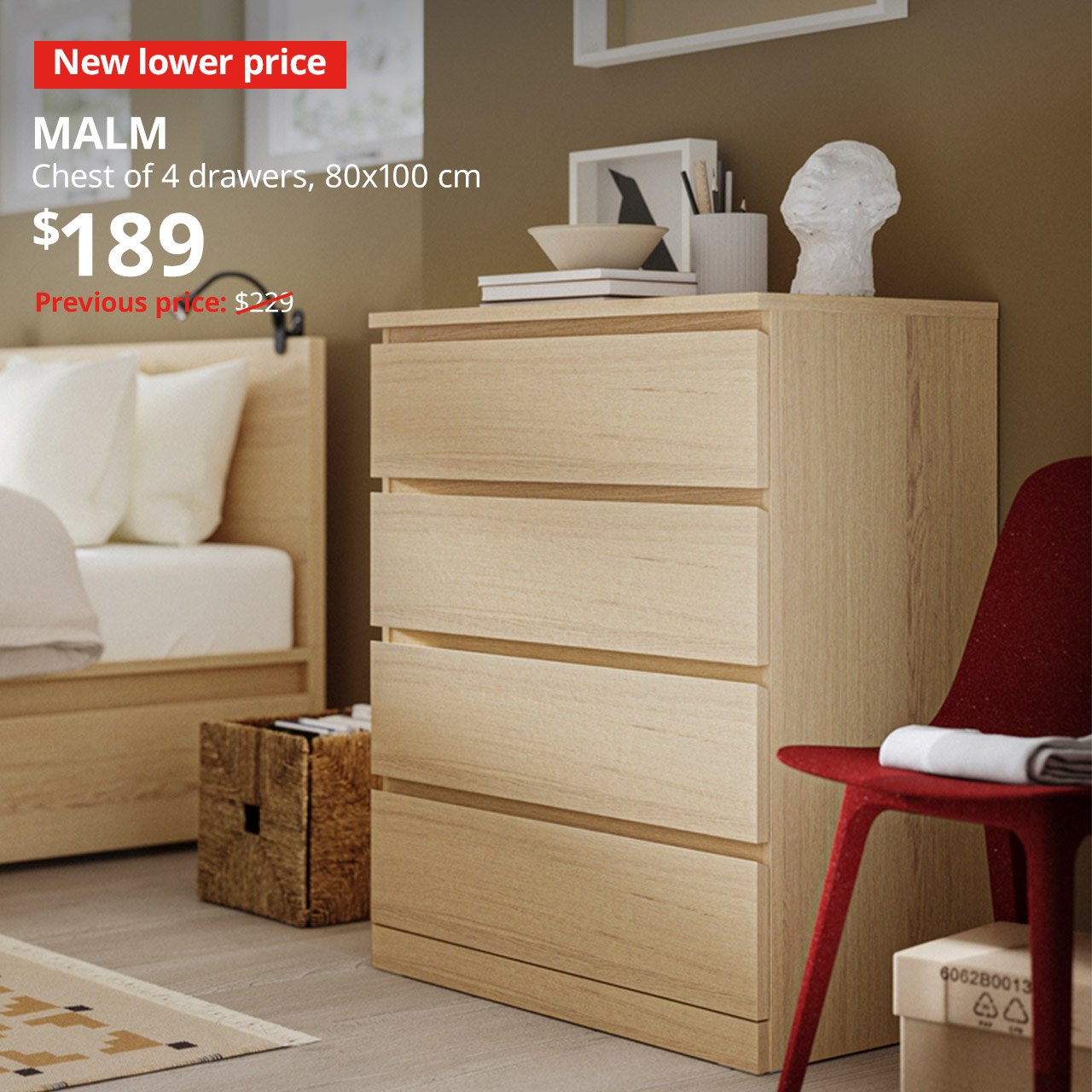 A white stained oak veneer MALM chest of 4 drawers in a bedroom setting next to a MALM bed. A red tag with white text that reads "New lower price", followed by a white text overlay that reads "MALM, Chest of 4 drawers, 80x100cm, $189. Previous price $229"