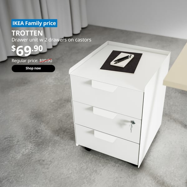 A white TROTTEN drawer unit with 2 drawers on castors. On the top left corner, a blue tag with white text that reads 