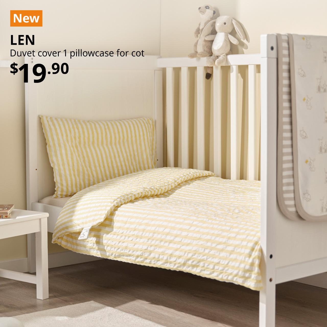A white yellow/stripe pattern seersucker LEN duvet cover with 1 pillowcase for cot is used in a baby cot in the chillren's bedroom setting. An orange "NEW" label is displayed in the top left corner of the image, featuring white text that reads: "LEN, Duvet cover 1 pillowcase for cot, $19.90".