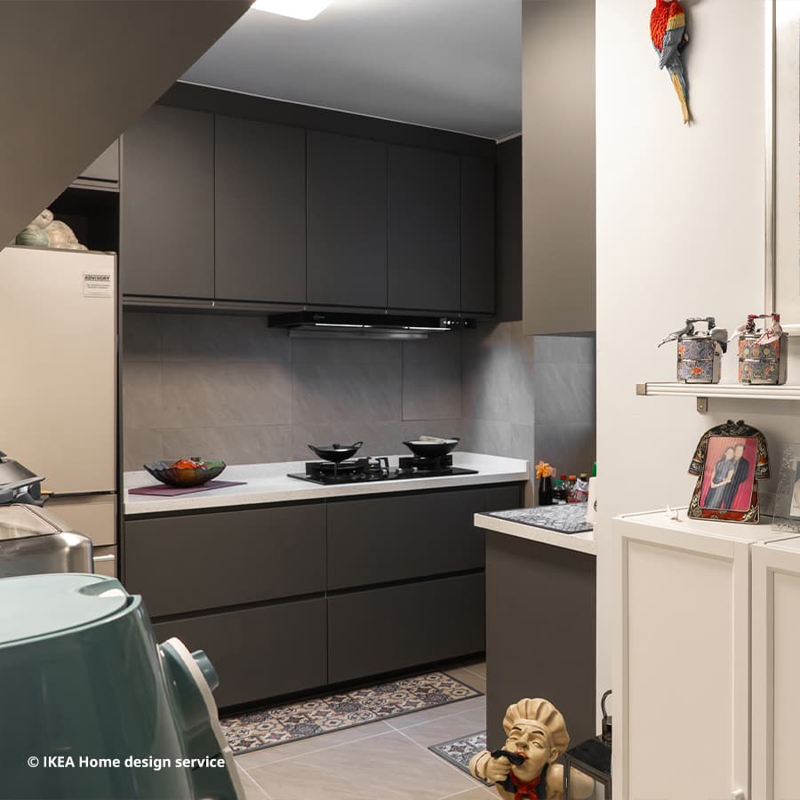 A wide shot of a contemporary style kitchen with Peranakan elements from a 3-room BTO flat in Pasir Ris, Singapore, designed by IKEA Home design service.