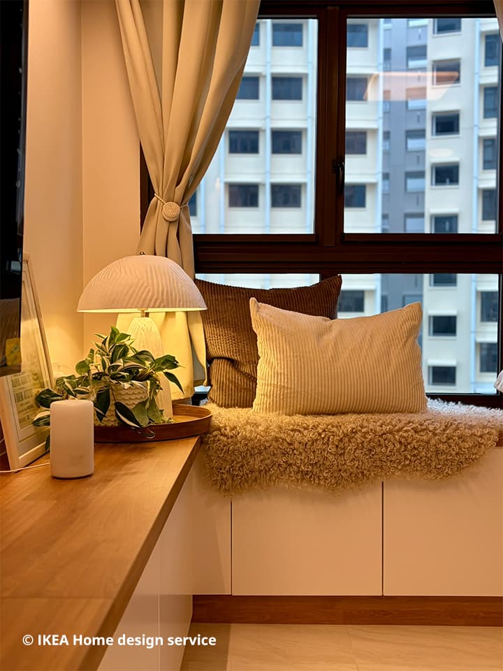 A wide shot of a customised bay cabinet in the living room from a traditional modern 4-room BTO flat in MacPherson, Singapore, designed by IKEA Home design service.