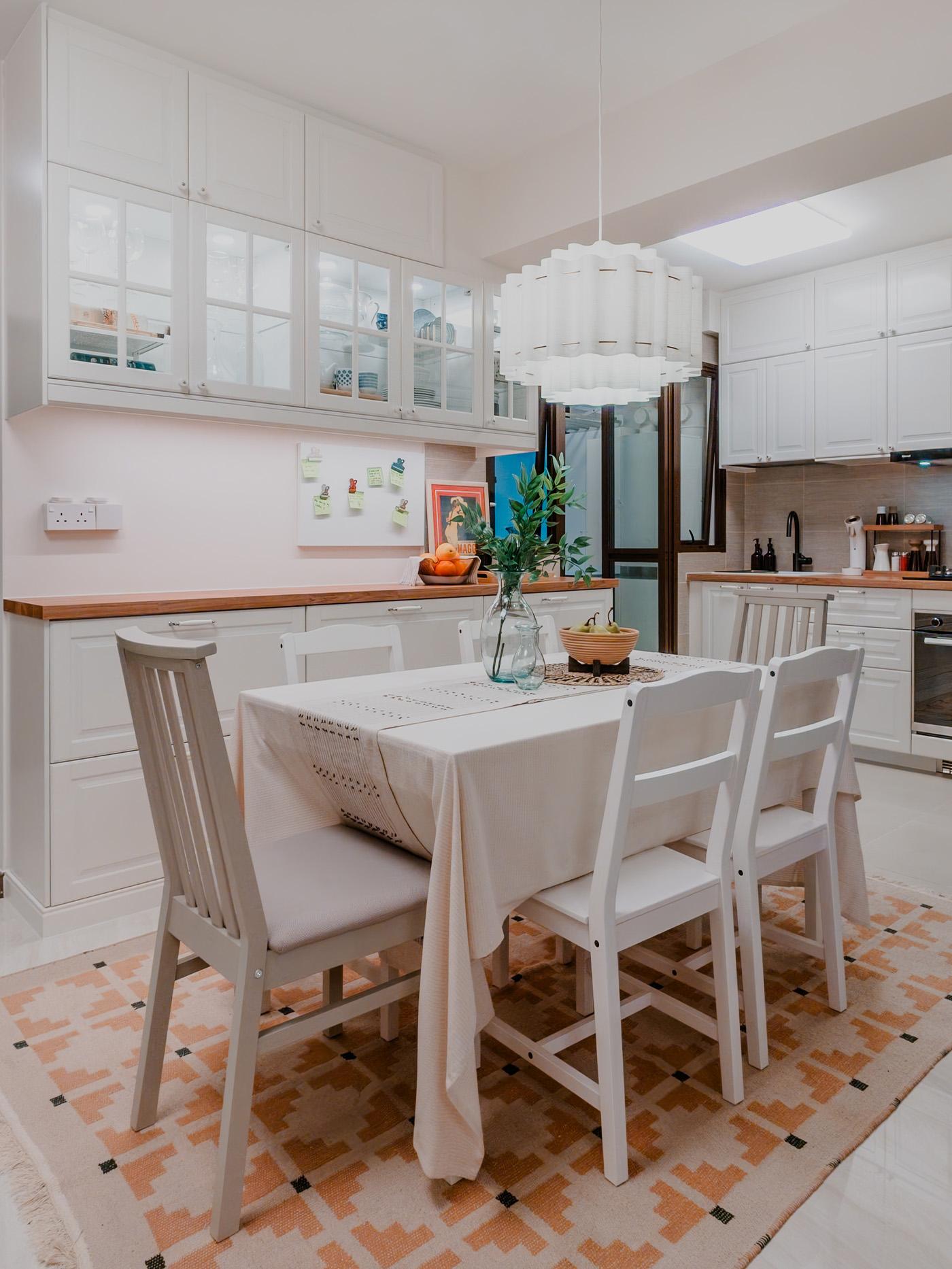 A wide shot of a dining room from a traditional modern 4-room BTO flat in MacPherson, Singapore, designed by IKEA Home design service.