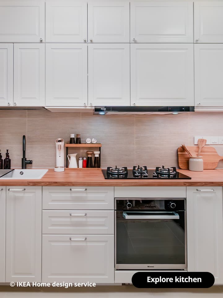 A wide shot of a kitchen from a traditional modern 4-room BTO flat in MacPherson, Singapore, designed by IKEA Home design service.