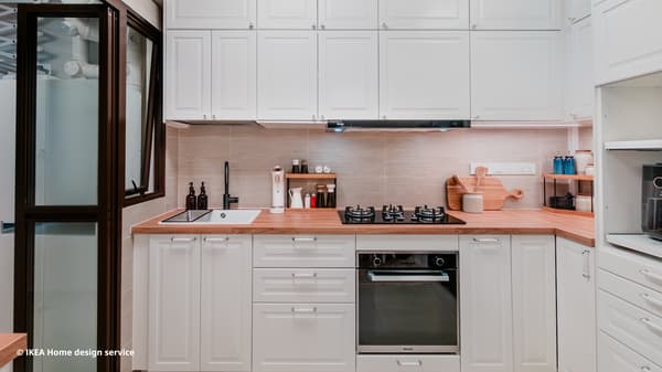 A wide shot of a kitchen from a traditional modern 4-room BTO flat in MacPherson, Singapore, designed by IKEA Home design service.
