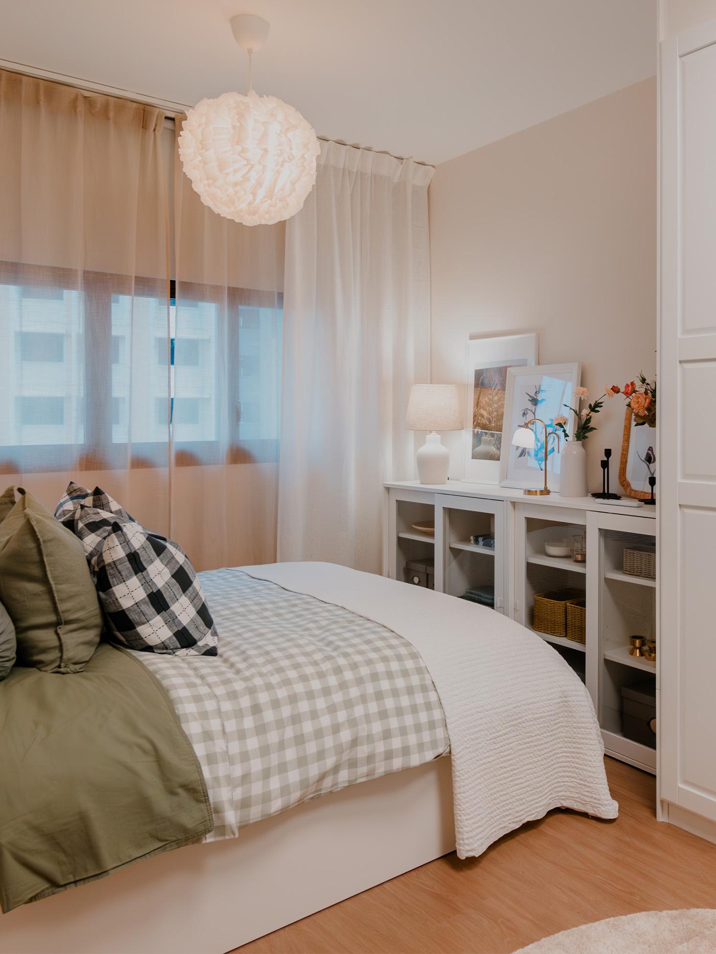A wide shot of a master bedroom from a traditional modern 4-room BTO flat in MacPherson, Singapore, designed by IKEA Home design service.