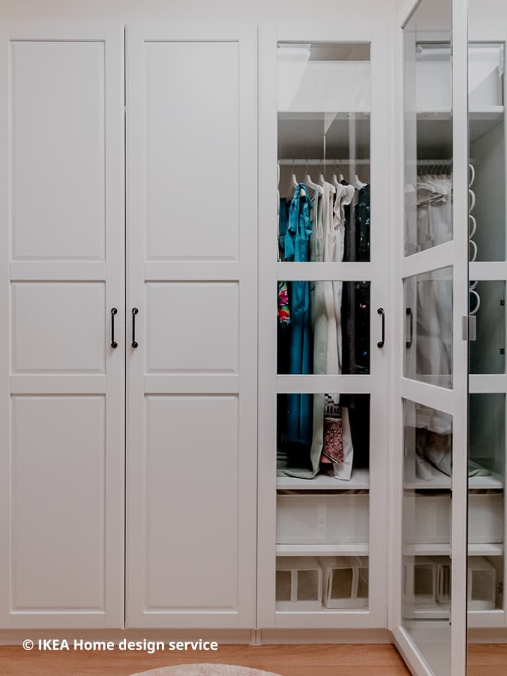 A wide shot of clothes displayed in a floor-to-ceiling PAX wardrobe from a traditional modern 4-room BTO flat in MacPherson, Singapore, designed by IKEA Home design service.