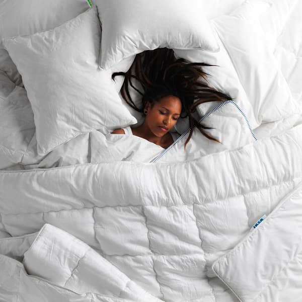 A woman asleep on her back.