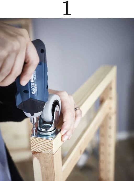 A woman assembling an IVAR shelf