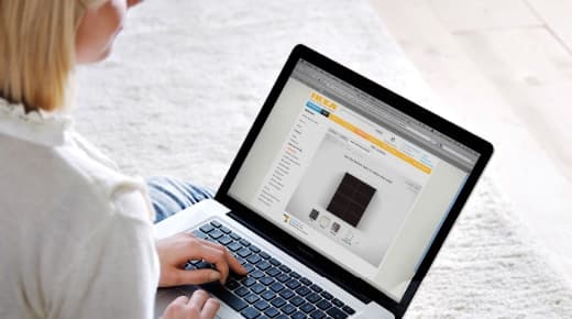 A woman using an IKEA planning tool on her laptop