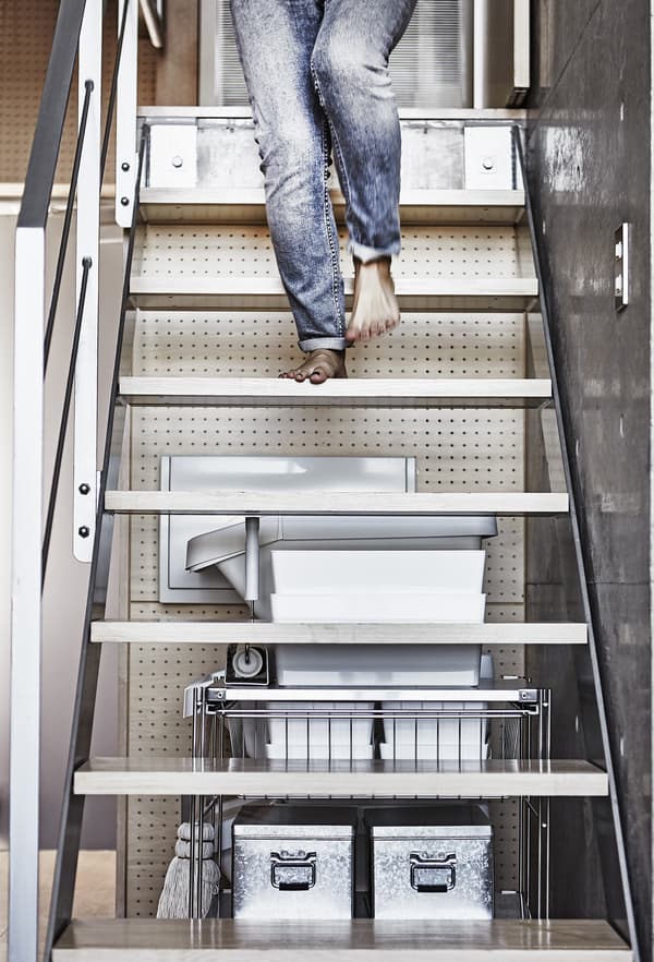 A woman walking down stairs.