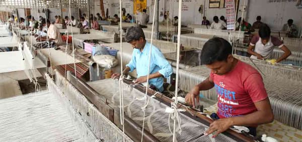 A workshop in India where IKEA rugs are being handwoven.
