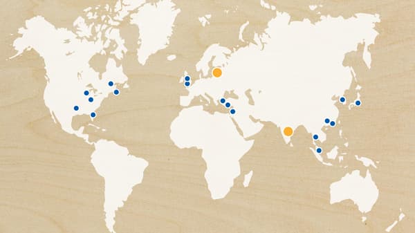 A world map showing with blue and oranged dotted locations to show IKEA store expansion and upcoming launches in 2018.