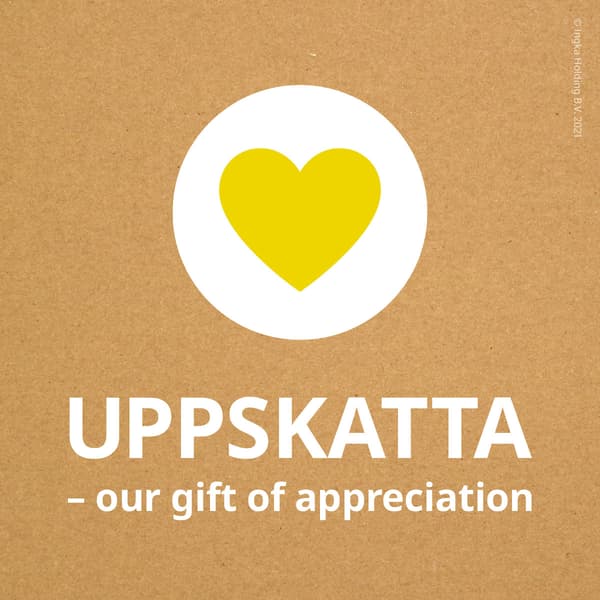 A yellow heart inside a white circle on a brown background with a message in white- UPPSKATTA - our gift of appreciation.