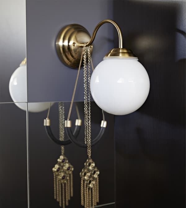 Add a little light to your vanity table so you can properly see all those finishing touches. LILLHOLMEN wall lamp from IKEA adds a big dose of style with its brass-colour base, thin rounded neck and white glass globe.