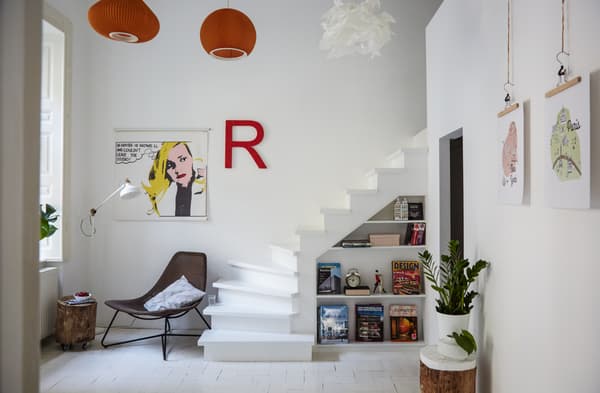 Add brightly coloured lampshades to monochrome decor.
