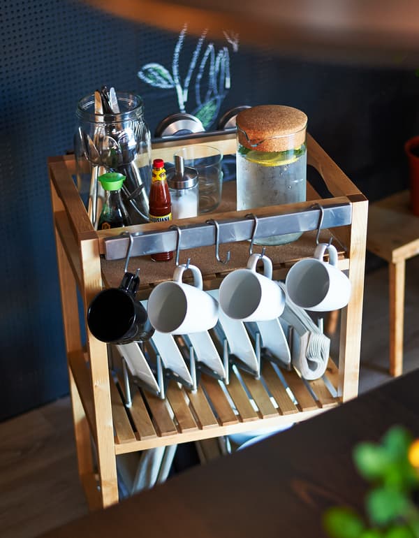 Add some hooks, a magnetic knife strip and some plate sorting organisers and you can transform a plain bathroom trolley into the perfect dining table server.