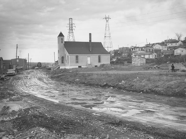 Africville - looking over the foundation of the school house, March 8 1965, City of Halifax Police Department photograph 102-16N-0065.F – Halifax Municipal Archives